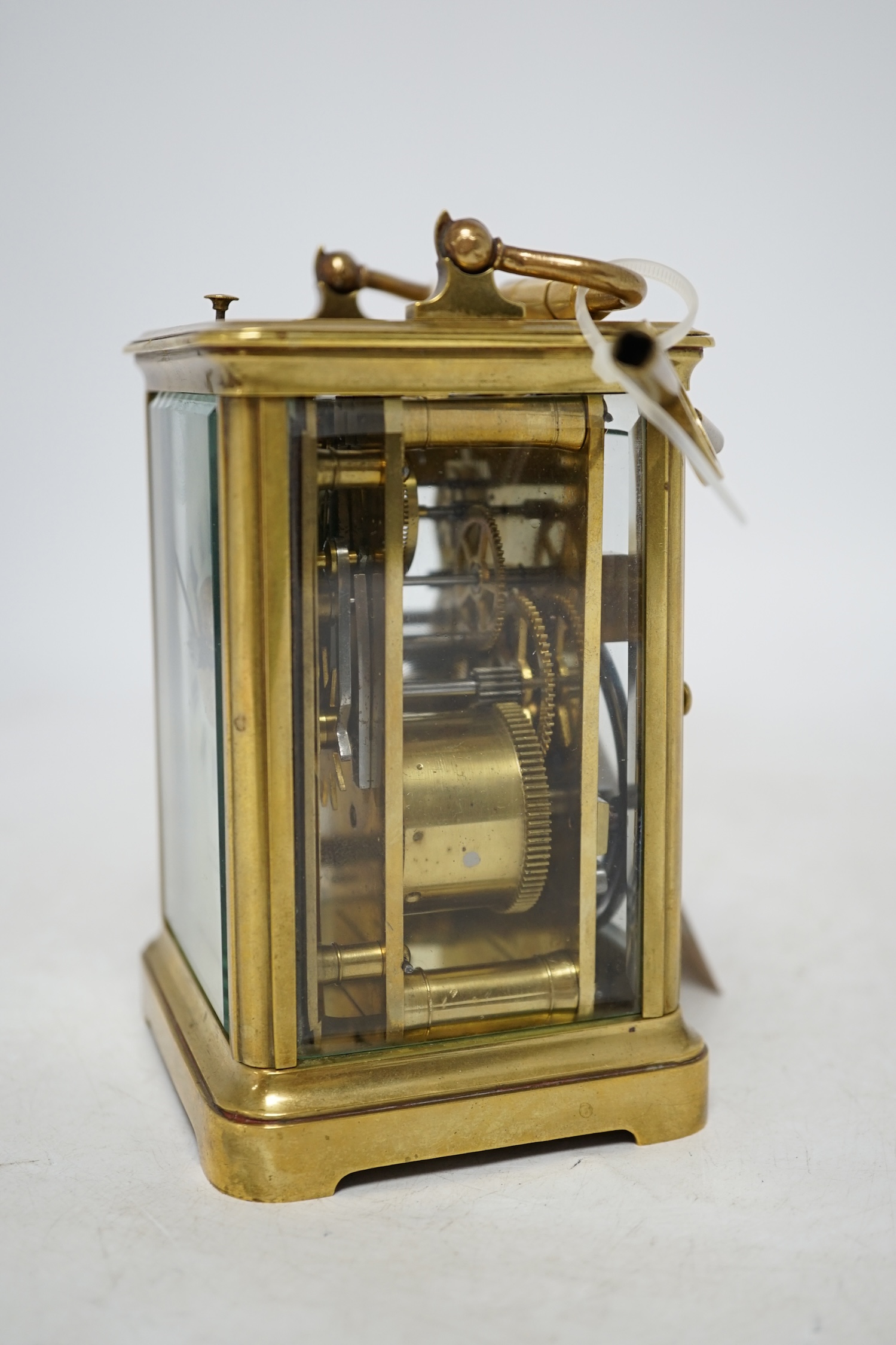 A brass cased repeating carriage clock with key, 14cm. Condition - good, currently ticking